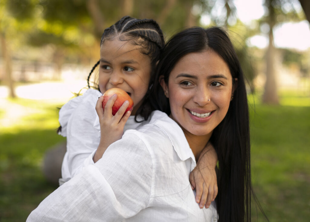 mother daughter spending time together outside park mother s day
